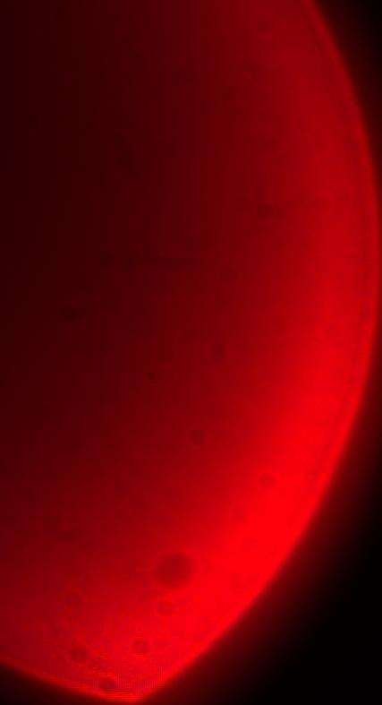 Cropped close-up of the LED from the left frame, showing a red gradient.