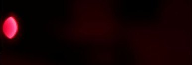 A dark frame with a small pink LED dot near the left edge.